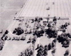 Aerial shot of Oxmoor estate taken prior to 1943.  The photograph shows the house (at center) with the wing additions and surrounding outbuildings.