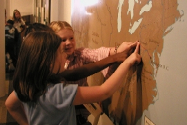 A map of the United States aids students in visualizing Lewis and Clark's geographical trail across the country. 