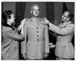 General Shoup (far right) assisted Mrs. Van Stockum in pinning the one-star rank insignia onto Brigadier General Ronald R. Van Stockum during his promotion ceremony in Washington, D.C., July 2, 1962. Defense Dept. Photo. Filson Manuscript Collection